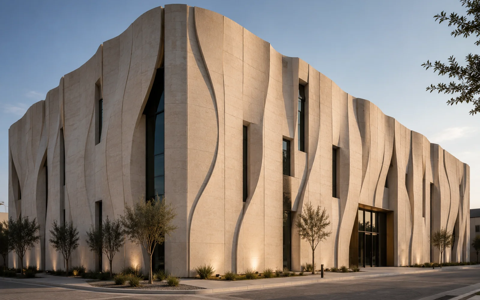 CNC-cut mashrabiya screen façade with patterned perforated metal panels across an elevation